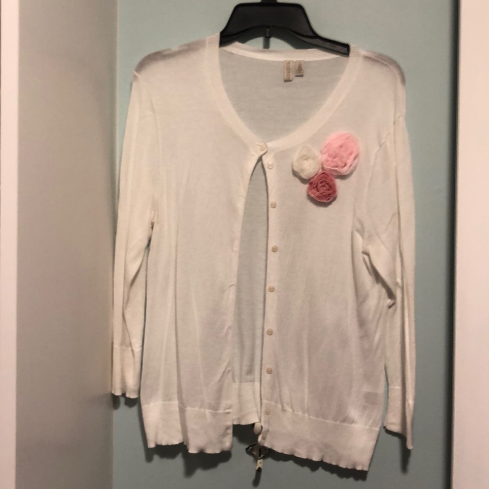 White cardigan with rosettes